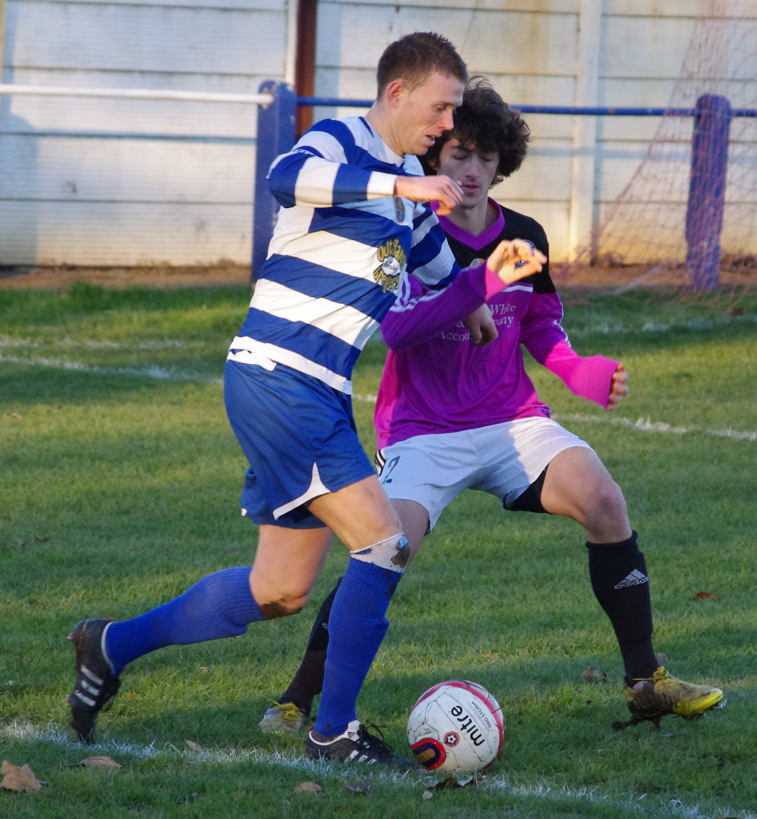 Glasshoughton captain Darrell Young holds off goalscorer Taylor Reis