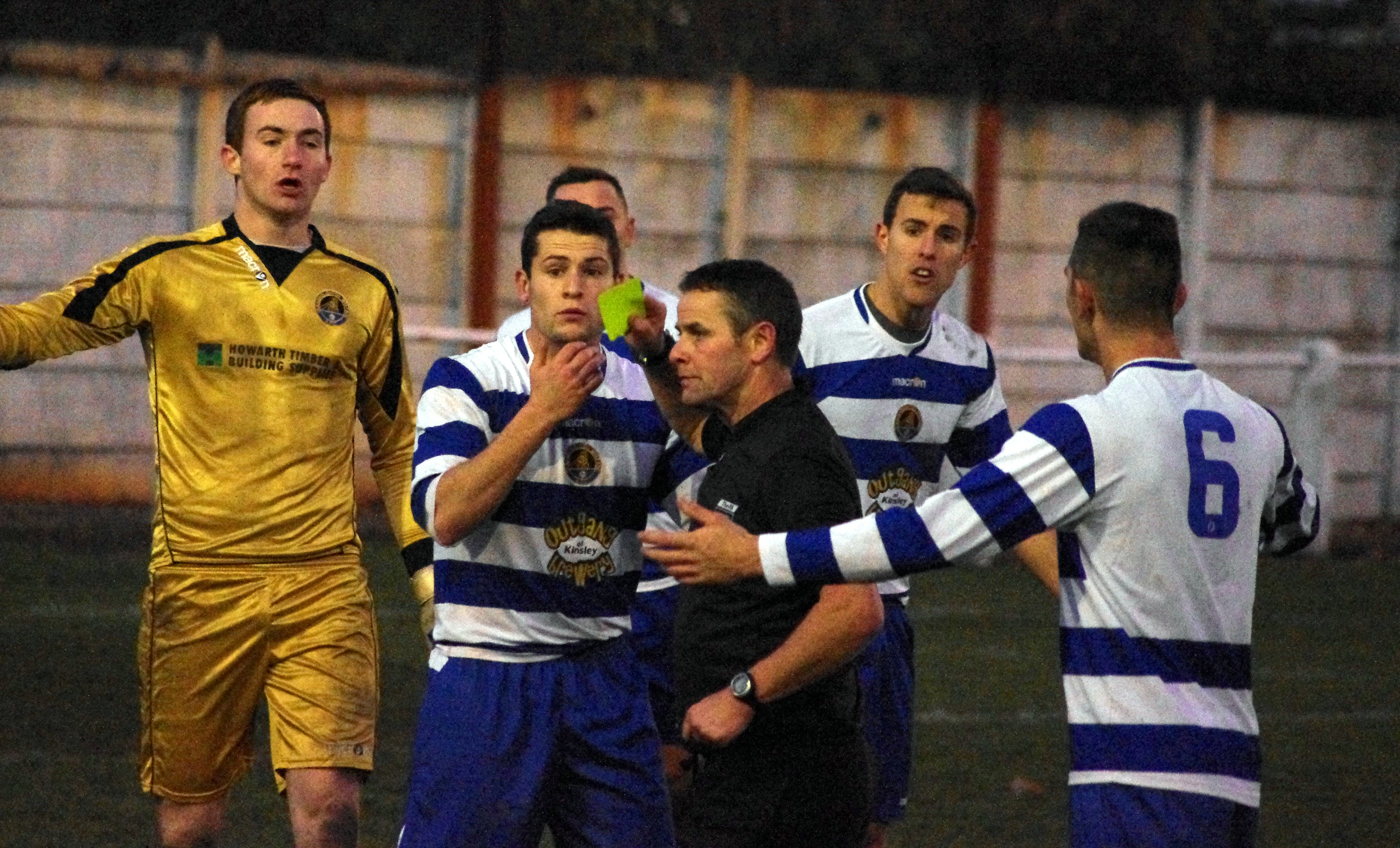 James Beaston, who made the challenge, is yellow carded