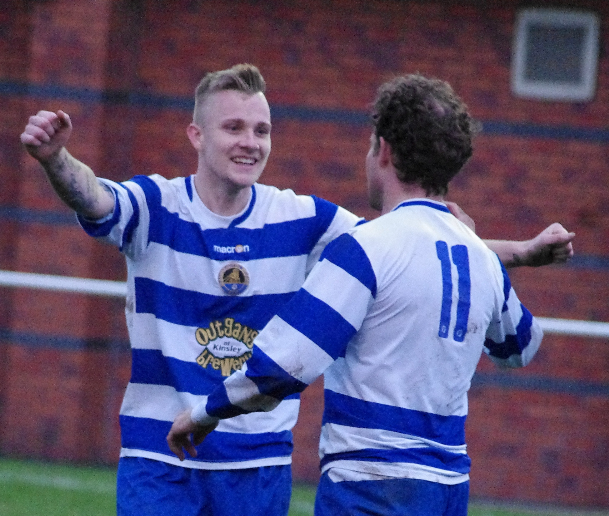 Glasshoughton forward Grieg McGrory congratulates Russ Headley for his goal