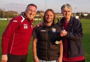 Mark 'Willy' Wilson is presented with a memento on his 900th career appearance during a spell with AFC Emley