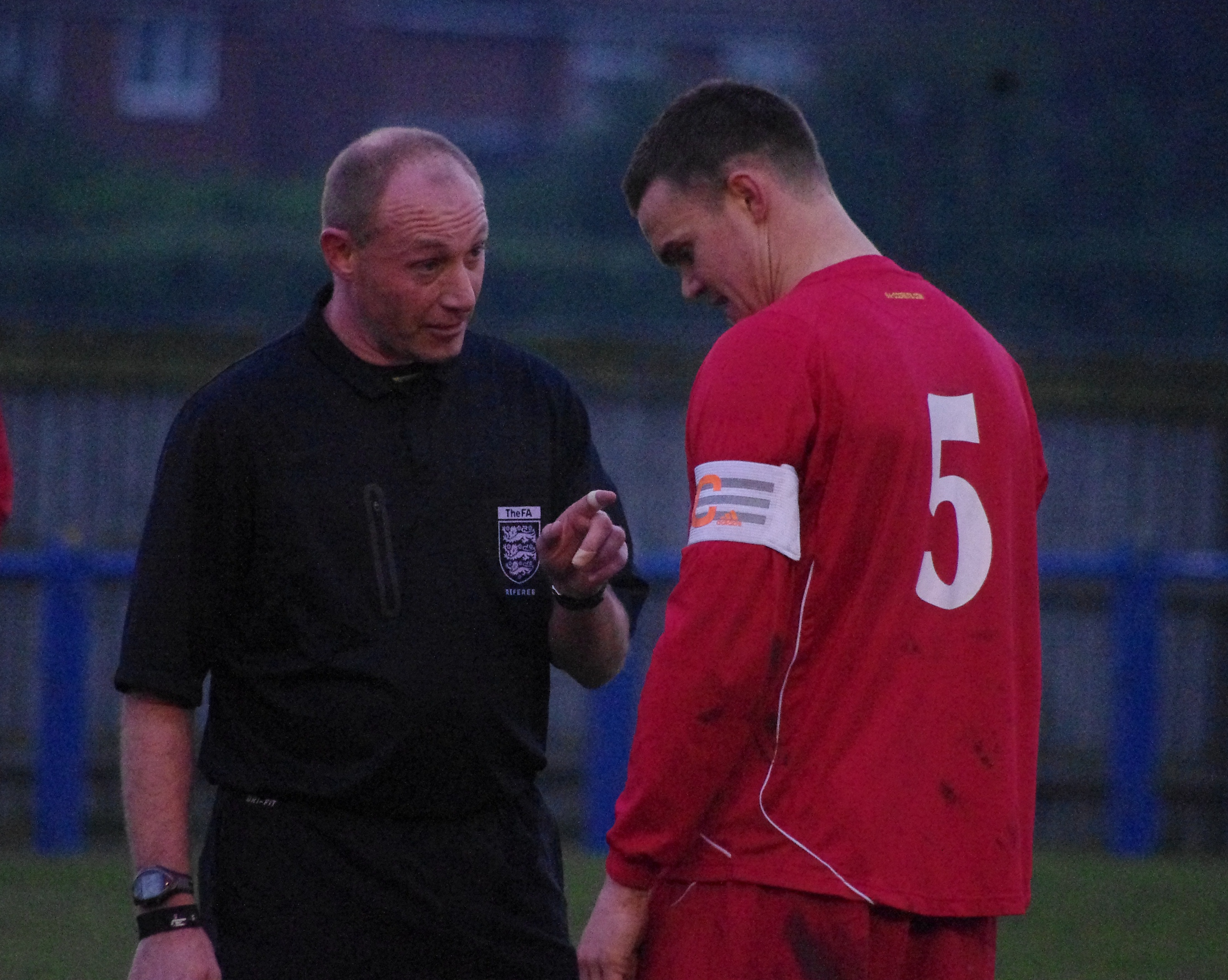 Referee David Benton warns Armthorpe captain Craig Morley during the first half