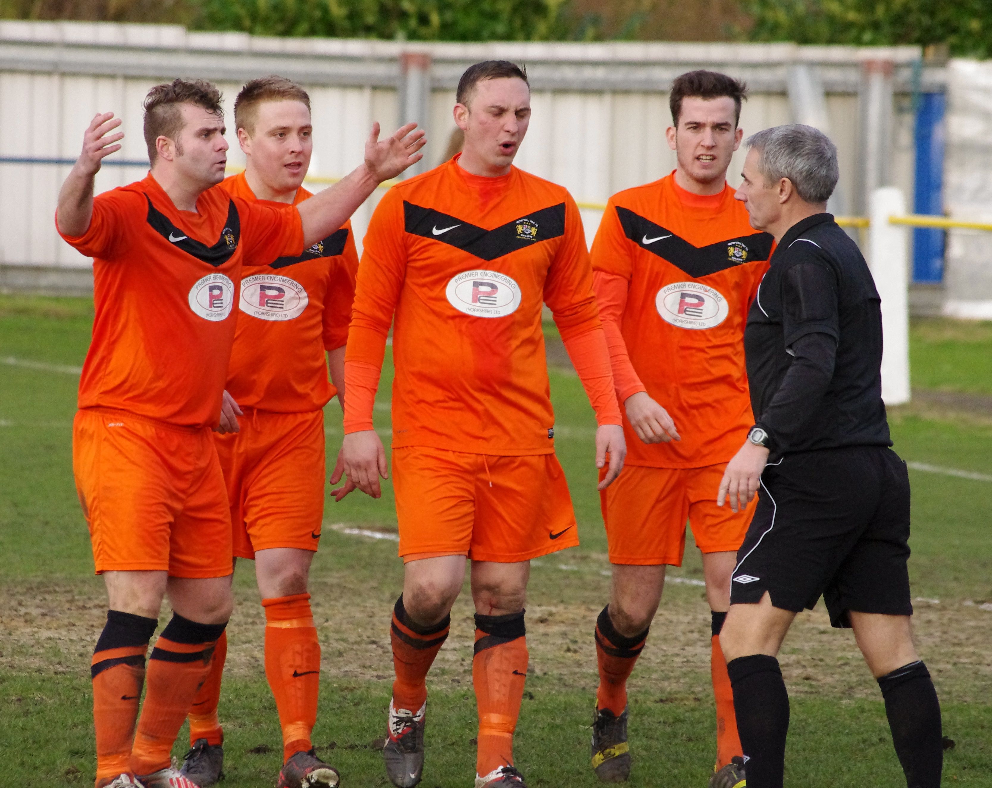 Athersley Recreation players protest after having a penalty awarded against them