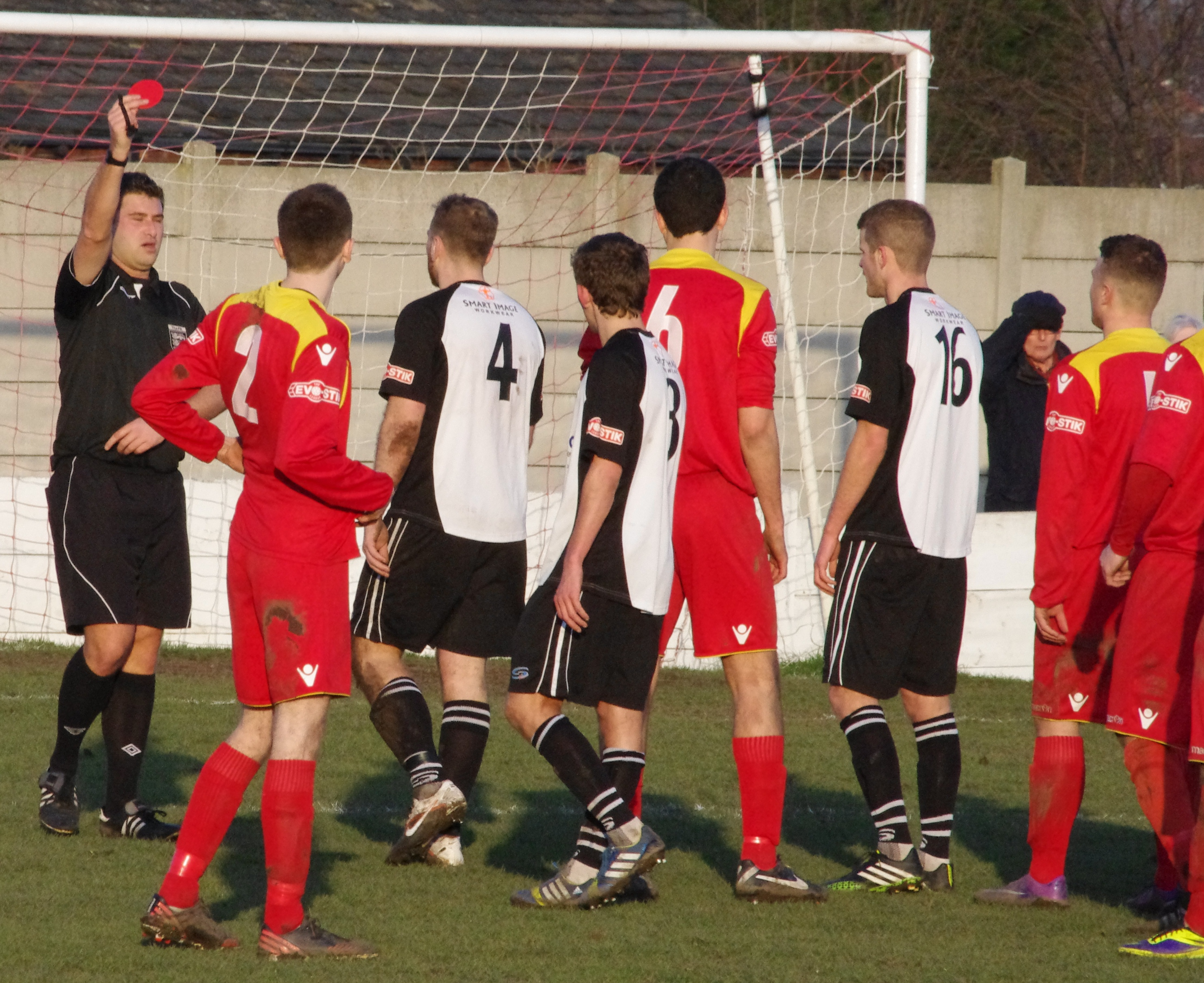 ... and is sent off by referee Adam Burgess for the challenge