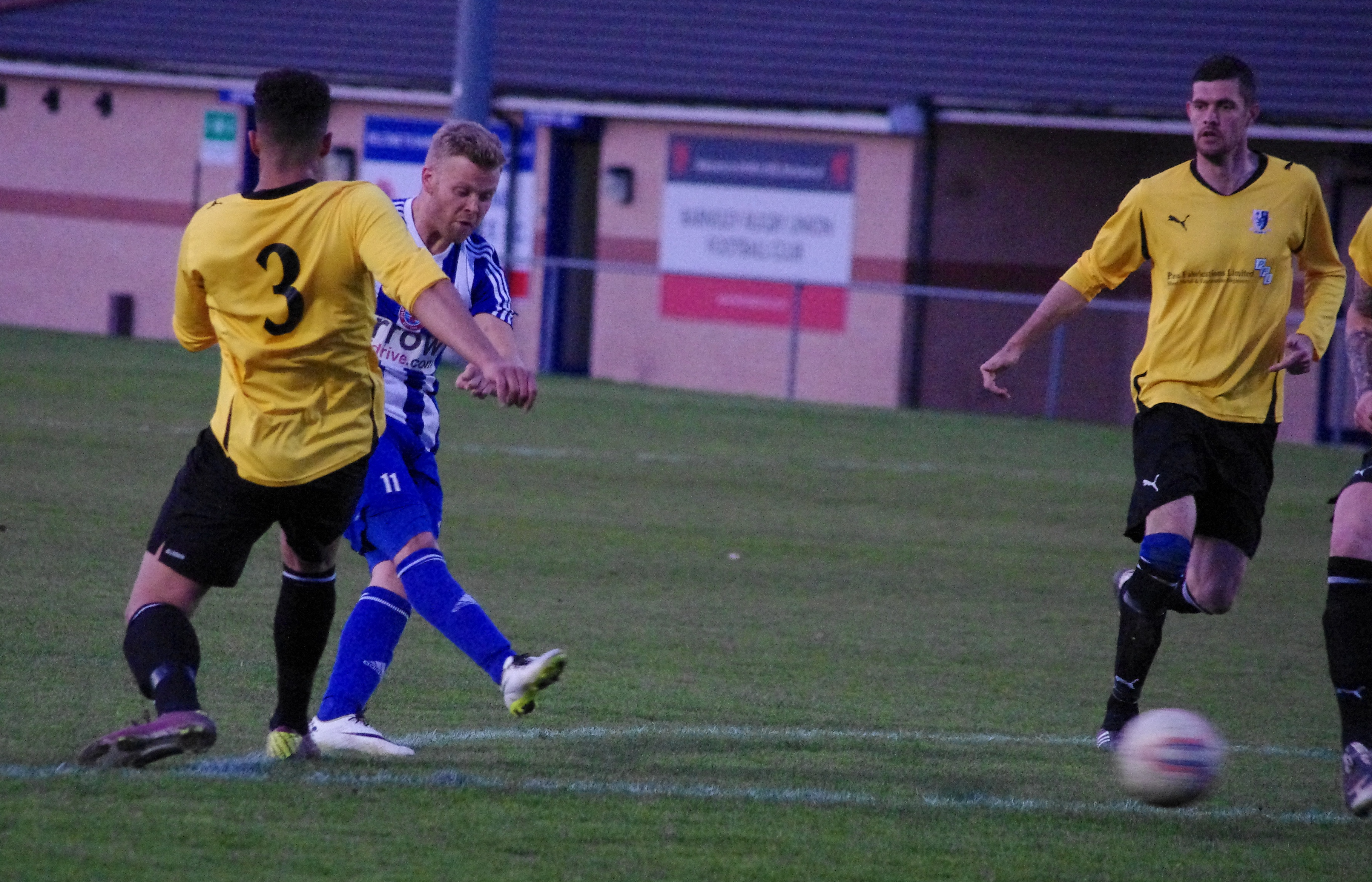 Shaw Lane striker Danny Frost shoots in the 2-0 win over Hallam