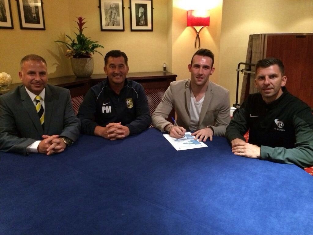 Paddy Miller, third right, pictured with chairman Matt Gore, Paul Marshall and James Gore after signing for Tadcaster Albion tonight