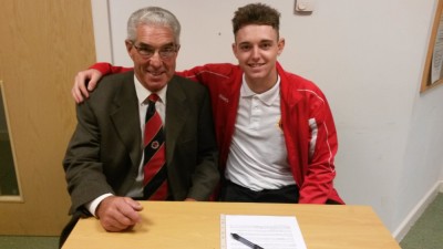 Brad Kerr (right), pictured with chairman John Cooper signs a contract at Worsbrough Bridge