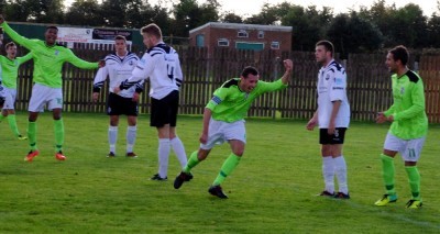 Ryan Brook runs off to celebrate AFC Emley's second goal