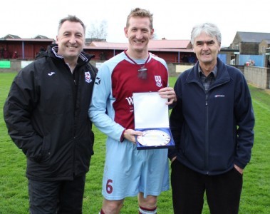 AFC Emley captain Paul Sykes receives a gift from the club after his recent 900th career appearance 