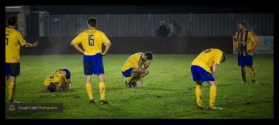 Ossett Town players slump to their knees after Harrogate Railway go 4-0 up. Photo: Caught Light Photography