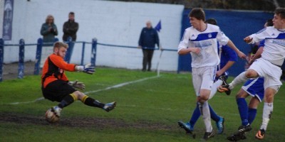 Pontefract goalkeeper Sam Andrew cannot stop Nash Connolly's free kick from going straight into the net