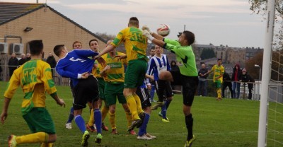 Michael Atherton heads Runcorn Linnets level in their 4-1 defeat at Shaw Lane