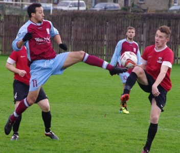 New Emley star Kurtis Noble challenges for the ball