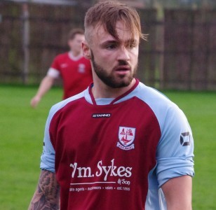 Mickey Starkey ran into the arms of Darren Hepworth after raising the roof at AFC Emley with the only goal in the 1-0 win over Shirebrook