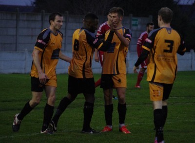 A group of Ossett Albion players congratulate Luke Sharry after his cross caused Nick Wood to score an own goal