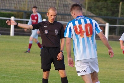 Referee Ricky Taylor wonders whether the player is pleased to see him