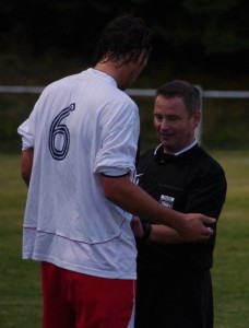 Yorkshire Amateur defender Jamie Hainsworth finally adds referee Colin Unwin to his extensive autograph collection