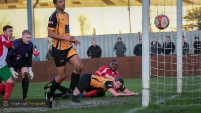 Ossett Albion goalkeeper Brett Souter and his defence watch Malachi Farquharson's shot land in the net. Photo: Caught Light Photography