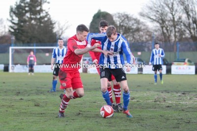 Shaw Lane goal-scorer Shane Kelsey battles his forward at Walsall. Picture: Walsall Wood