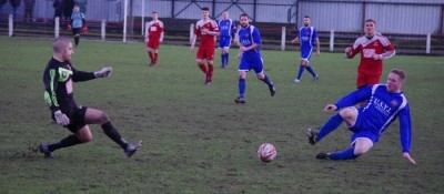 Selby Town goalkeeper Robert Zand's nightmare afternoon ended after this 50/50 challenge with Craig Rouse