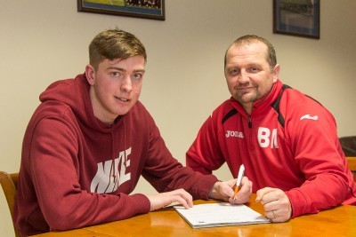 Harrogate Railway goalkeeper Tom Goodwin signing his contract, alongside Billy Miller. Photo: Caught Light Photography