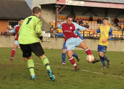 Hat-trick hero Ash Flynn scores one of his three goals in AFC Emley's 8-0 demolition of Lincoln Moorlands Railway. Picture: Mark Parsons