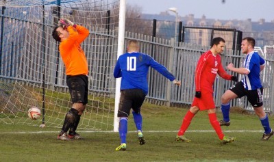 Flackwell goalkeeper Robert Bullivant looks heartbroken after Joe Thornton's free kick nestles in the net