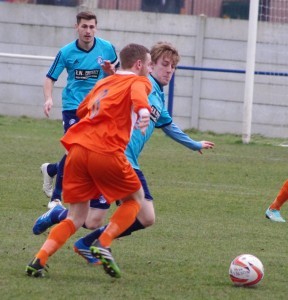 Hemsworth midfielder Robbie Crapper tries to stop a Louth attack