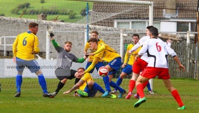 A goal-mouth scramble in Stocksbridge goalkeeper Sam Andrew's penalty area. Photo: whiterosephotos.co.uk