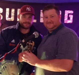 Emmerdale's Danny Miller (left) receives his man of the match award from organiser John Moses