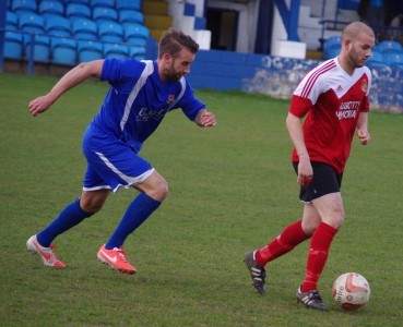 Venezuelan striker Hilliard Serrano controls the ball as Pontefract's Luke Forgione lurks