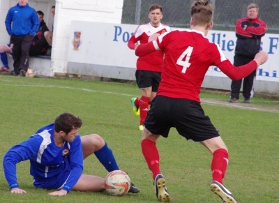 Aaron Moxam wins the ball off Knaresborough captain Matt Duerden