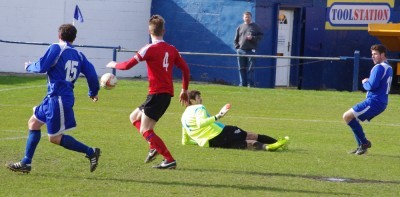 Magic moment: Aaron Moxam slots home the winner for Pontefract Collieries