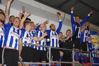 Shaw Lane Aquaforce players wait for Sam Denton to lift the trophy