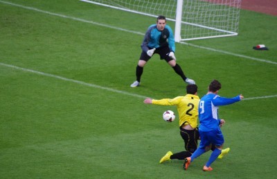 Thompson slots the ball past Ben Saynor