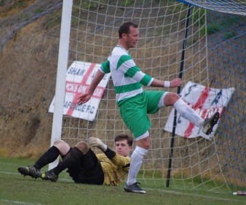 Matt Cressey kicks the ball into the net after another Shaw Lane goal