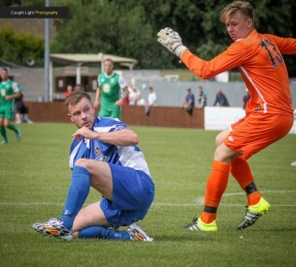 Steve Bromley charges down Darlington goalkeeper Jack McClaren. Picture: Caught Light Photography