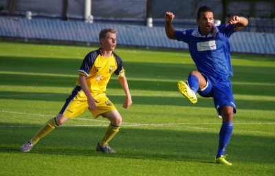 New Farsley defender Kyle Harrison clears the ball