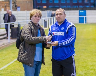 James Grayson presents Wayne Benn with the Christian's Carpets manager of the year award 