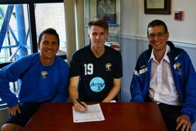 Mark Simpson pledges his future to Garforth Town. Simpson is pictured with Graham Nicholas and chairman Brian Close (right)