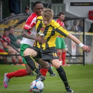 Cameron Lyn attempts to stop Harrogate Town's Jordan Thewlis during the John Smith's Trophy game. Picture: Caught Light Photography