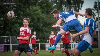 Harrogate Railway stalwart Dan Thirkell wins a header for his side. Picture: Caught Light Photography