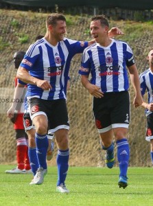 Gav Allott congratulates Rhys Meynell after Shaw Lane's opening goal. Photo: whiterosephotos.co.uk