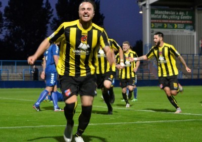 Luke Shiels celebrates scoring the winner for Harrogate Town. Picture: Craig Hurle