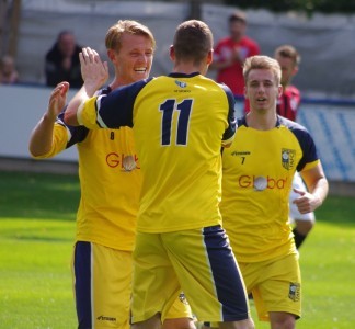 Nick Black and Adam Baker congratulate Joe Thornton after his first goal in Tadcaster's 6-3 win over Maltby