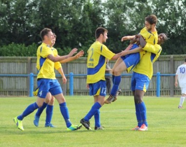 Garforth celebrate captain Andy Hawksworth's late winner