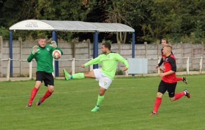 Emley striker Ash Flynn prepares to take the ball around the Teversal goalkeeper to open his account for the day. Picture: Mark Parsons