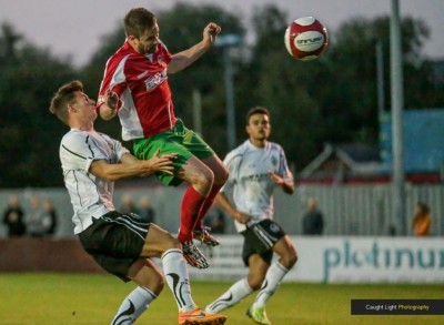 Steve Bromley heads Ryan Sharrocks' superb cross home in Harrogate Railway's 2-0 win over Mossley. Picture: Caught Light Photography