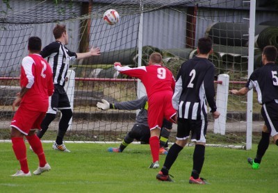 Askern midfielder Alex Rennie handles Wetherald's header after just 30 seconds