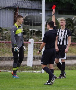 Referee Henry Naylor shows Rennie (unpictured) his red card