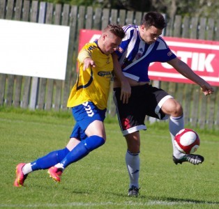 Danny Critchlow battles with Aquaforce defender Stef Holt